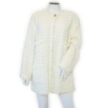 A Chanel early 1990's cream boutique jacket, with fringing to all edges, single CC silver-tone