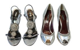 A pair of Fendi lady's metallic silver sandals with three diamante circle detail and a pair of Dolce