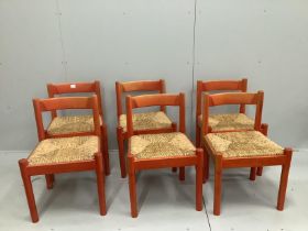 A set of six Conran Magistretti red stained beech dining chairs with rush work seats***CONDITION