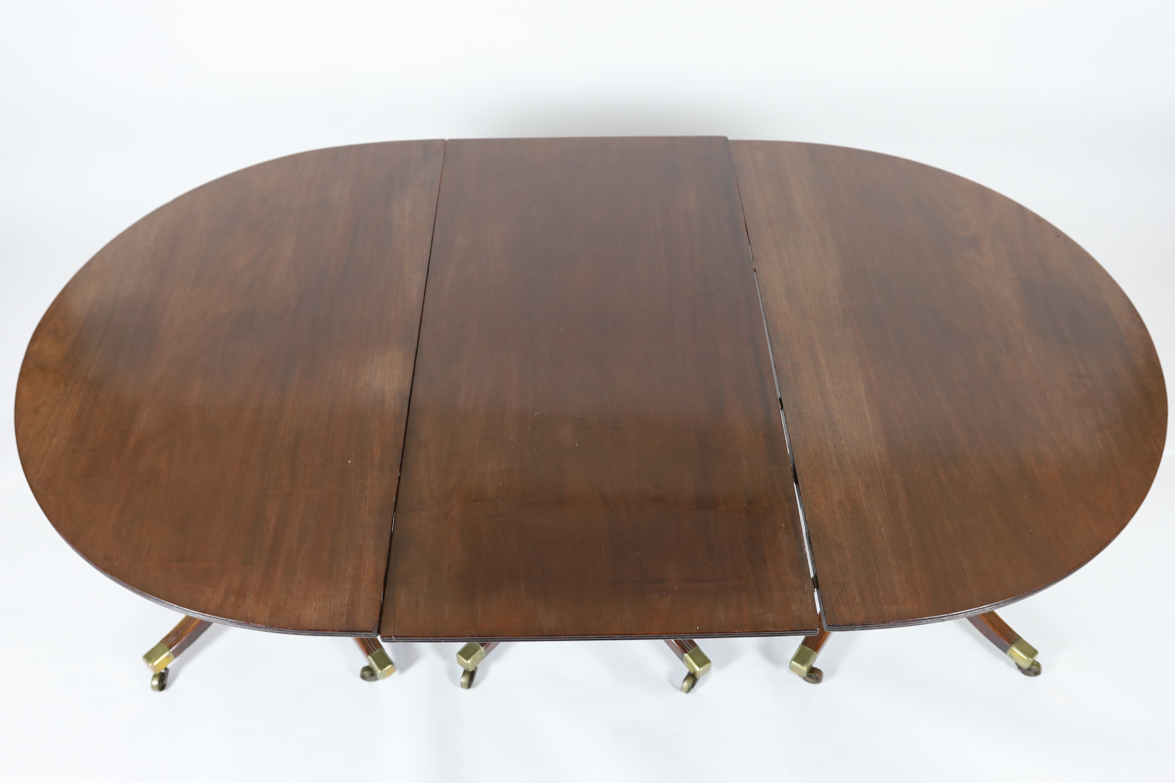 A George III style mahogany triple pillar D end extending dining table in the manner of Gillows, - Image 2 of 6