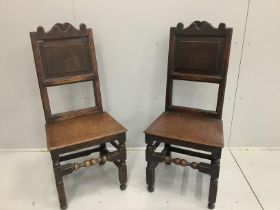 A pair of 17th century oak panel back chairs, width 47cm, height 108cm***CONDITION REPORT***PLEASE