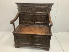 A small carved oak monk's bench, circa 1900, width 100cm, height 108cm***CONDITION REPORT***PLEASE