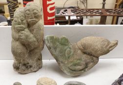 Two large Shona weathered stone carvings, 1960s-70s; a group with pregnant woman and a bird, tallest
