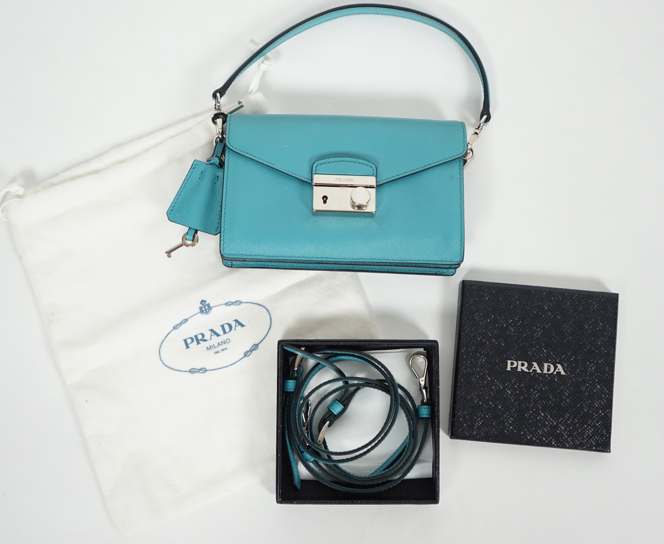 A Prada Saffiano Lux Mini Sound bag in Turchese, silver-tone hardware, with bag, box and - Image 7 of 8