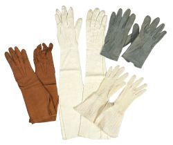 A pair of lady's Hermès skin gloves, boxed and three other pairs of gloves***CONDITION REPORT***