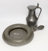 An 18th/19th century pewter measure and an 19th century pewter pan, 46cm long***CONDITION REPORT***