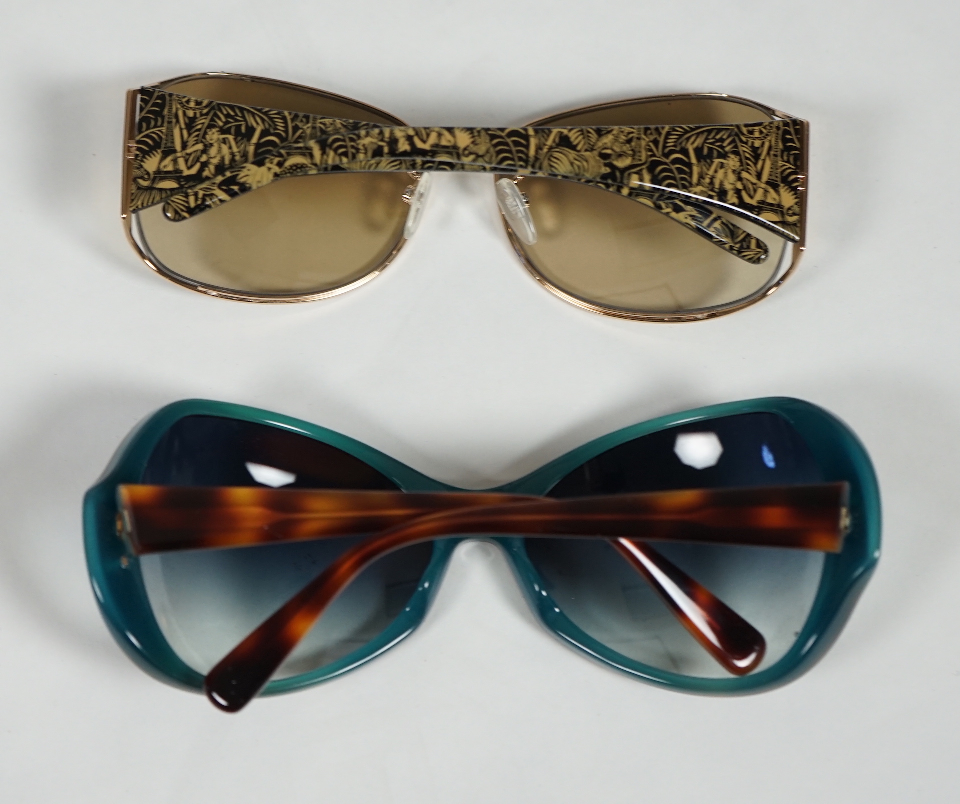 A pair of Paul Smith and a pair of Jean Paul Gautier lady's sunglasses with cases.***CONDITION - Image 6 of 6