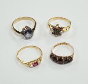 A late Victorian yellow metal, emerald, garnet and split pearl cluster set ring, in the