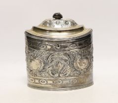 A George III silver oval tea caddy, with later embossed decoration, Peter & Ann Bateman, London,