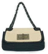 ** ** A Chanel No 5 Madamoiselle tri colour canvas and leather, chain shoulder handbag, with dust