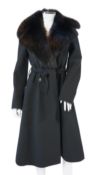 A Dolce & Gabbana lady's black wool coat with detachable fur collar, leopard print lining and tie