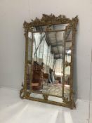 A late 19th century French gilt gesso wall mirror, width 118cm, height 170cm***CONDITION REPORT***