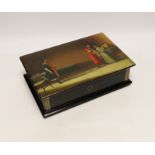* * A large Russian lacquer box, by Lukutin, pre-1917, painted with a nobleman and guest in an
