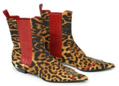 A pair of Christian Dior, Hardcore Collection, lady's leopard canvas ankle boots, with red leather