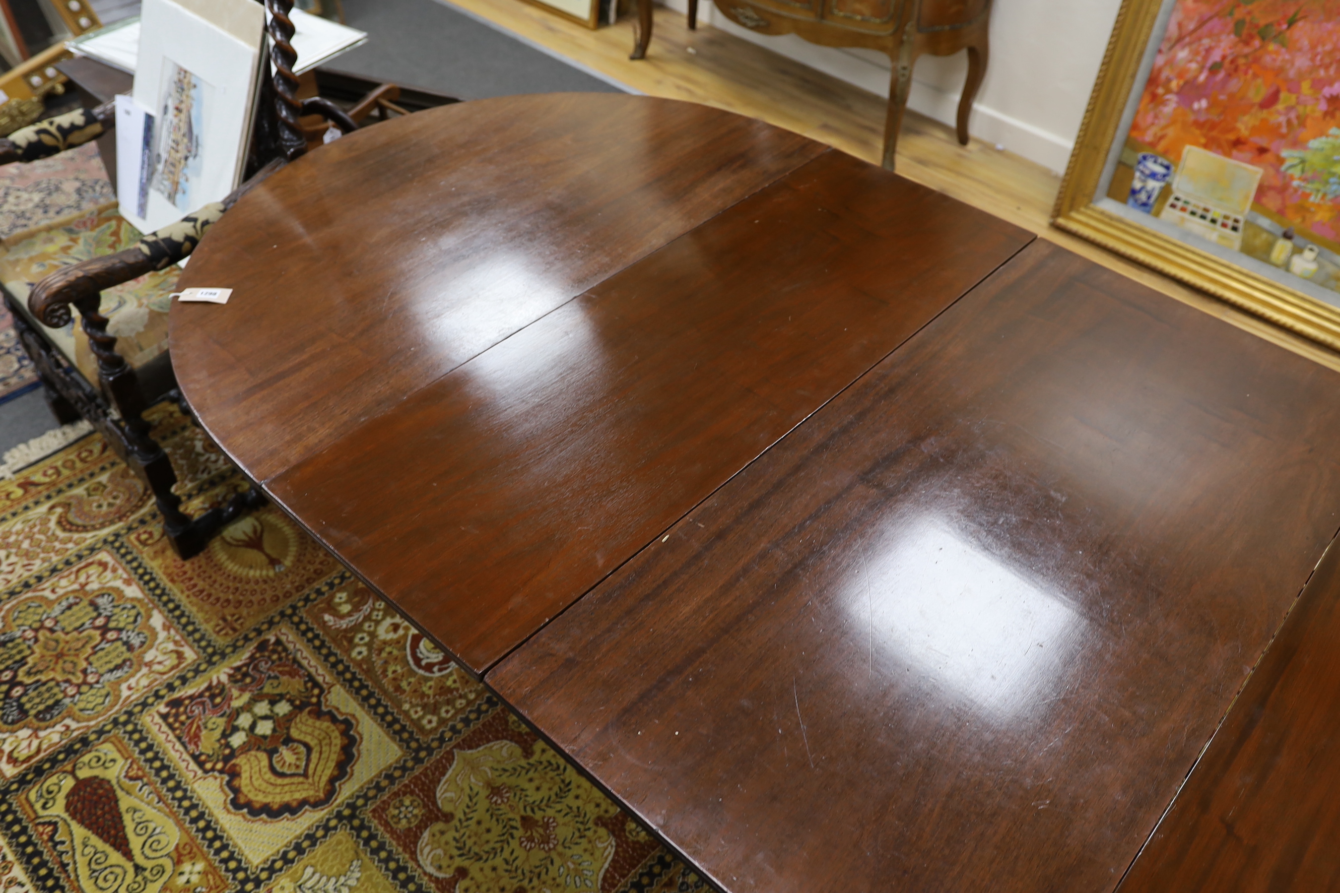 A George III style mahogany triple pillar D end extending dining table in the manner of Gillows, - Image 5 of 6