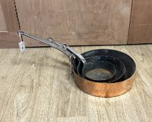 Three copper pans, largest diameter 35cm***CONDITION REPORT***PLEASE NOTE:- Prospective buyers are