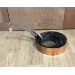 Three copper pans, largest diameter 35cm***CONDITION REPORT***PLEASE NOTE:- Prospective buyers are
