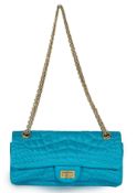 A Chanel medium-sized 2-55 bag in turquoise blue silk satin stitched with a quilted crocodile