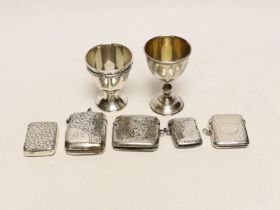 An early 20th century Russian 84 zolotnik egg cup, 69mm a later silver egg cup and five assorted
