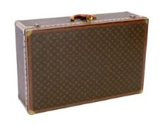 A Louis Vuitton monogram canvas and tan leather suitcase, with label for Paris and Nice number