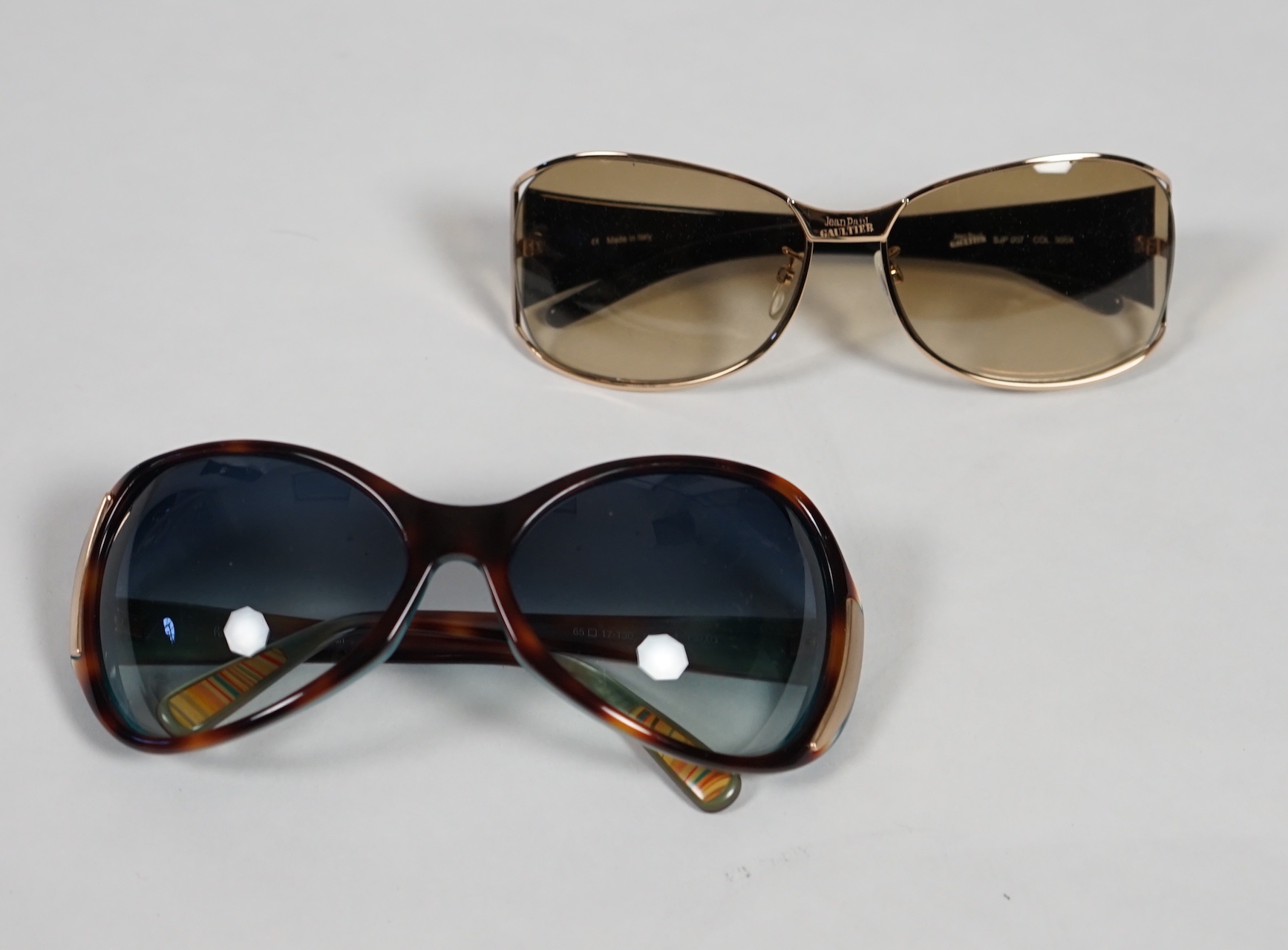 A pair of Paul Smith and a pair of Jean Paul Gautier lady's sunglasses with cases.***CONDITION - Image 2 of 6
