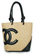 ** ** A Chanel Cambon Ligne black and beige quilted leather tote, the Cambon Ligne tote features a
