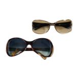 A pair of Paul Smith and a pair of Jean Paul Gautier lady's sunglasses with cases.***CONDITION