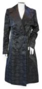 A Escada lady's monogram black trench coat, size 38***CONDITION REPORT***In good lightly worn