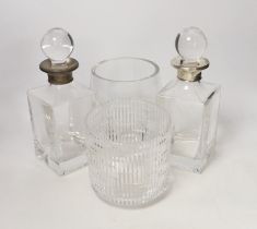 A pair of silver collared decanters and stoppers and two glass vases, decanters 26cm***CONDITION