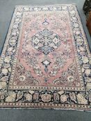 A Kashan mauve ground rug, 202 x 133cm***CONDITION REPORT***PLEASE NOTE:- Prospective buyers are