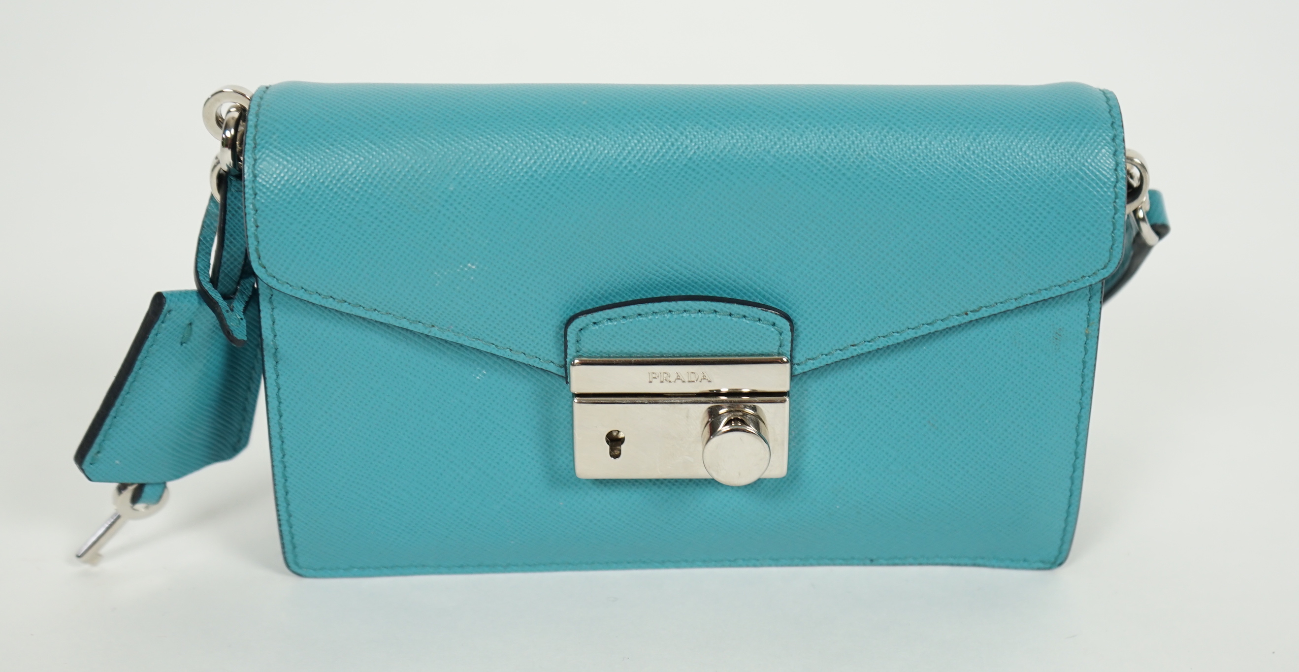 A Prada Saffiano Lux Mini Sound bag in Turchese, silver-tone hardware, with bag, box and - Image 4 of 8