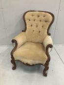 A Victorian carved mahogany button back armchair***CONDITION REPORT***PLEASE NOTE:- Prospective