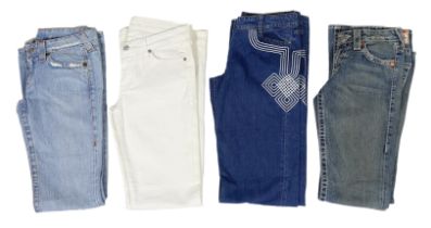 Four pairs of lady's designer jeans, two True Religion, a Celine and a 7 For All Mankind, two blue