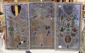 Three stained glass panels of birds and foliage, 71cm high, 39cm wide (a.f.)***CONDITION REPORT***