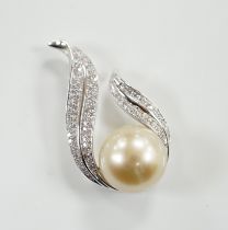 A modern 18ct white gold, single stone South Sea cultured pearl and diamond chip cluster set