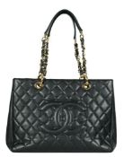 ** ** A Chanel vintage black quilted Caviar Timeless Grand Shopping Tote, gold hardware, 2013.