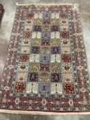 A Baktiari cream ground rug with divided field and triple border, 215 x 136cm***CONDITION REPORT***