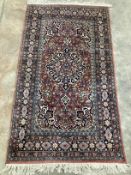 A North West Persian mauve ground multi-bordered rug, 165 x 94cm***CONDITION REPORT***PLEASE