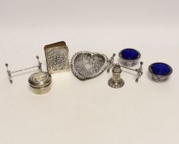 An Edwardian repousse silver mounted small bible, a silver circular pill box, a pair of silver