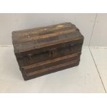 An Edwardian domed top trunk, width 77cm***CONDITION REPORT***PLEASE NOTE:- Prospective buyers are