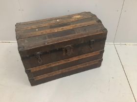 An Edwardian domed top trunk, width 77cm***CONDITION REPORT***PLEASE NOTE:- Prospective buyers are