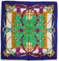 A Hermès 'Grand Manège' Henry d'Origny silk scarf, purples, golds, green, turquoise and pink