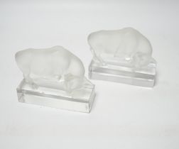 Rene Lalique, two frosted glass paperweights modelled as a bull, signed ‘Lalique France’ to base,