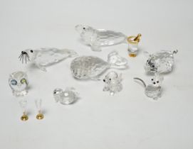 Eight Swarovski crystal animal ornaments and a miniature set of a Champagne cooler and two Champagne