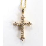 A modern 9ct gold and diamond chip set cross pendant, overall 30mm, on a 9ct gold chain, 40cm, gross