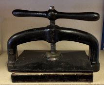 A Victorian black painted cast iron book press, the plate 38 x 25.5cm