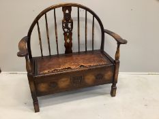 An early 20th century oak and beech hall settle with hinged box seat, width 100cm, depth 46cm,