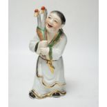 A Chinese enamelled porcelain figure of a man with two geese, 25cm high