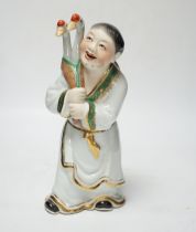 A Chinese enamelled porcelain figure of a man with two geese, 25cm high