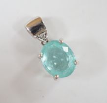 An 18ct white gold and single stone oval cut paraiba tourmaline pendant, with single stone diamond